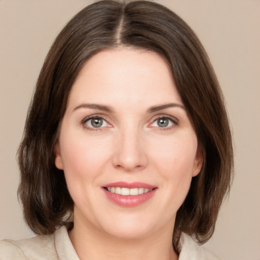 Joyful white young-adult female with medium  brown hair and brown eyes