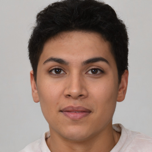 Joyful latino young-adult female with short  brown hair and brown eyes