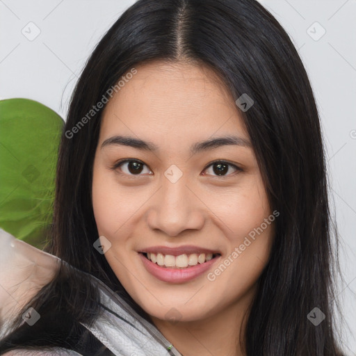 Joyful asian young-adult female with long  brown hair and brown eyes