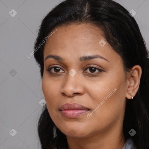 Joyful latino young-adult female with long  brown hair and brown eyes