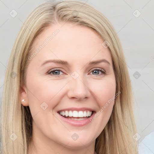 Joyful white young-adult female with long  brown hair and blue eyes