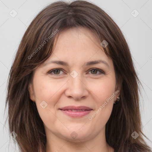 Joyful white adult female with medium  brown hair and brown eyes