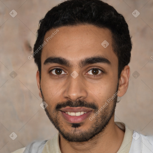 Joyful latino young-adult male with short  black hair and brown eyes