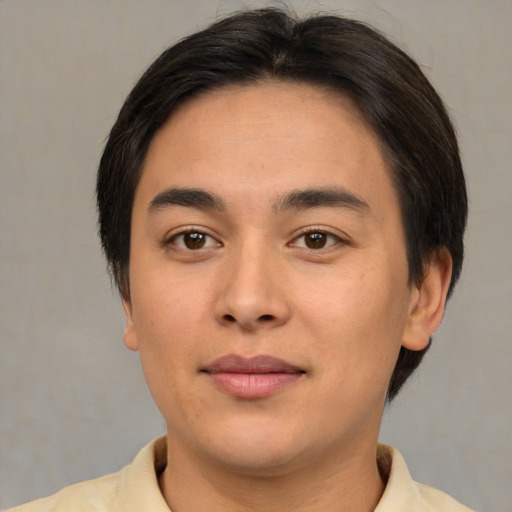 Joyful asian young-adult male with short  brown hair and brown eyes