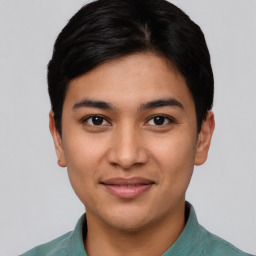 Joyful asian young-adult male with short  black hair and brown eyes