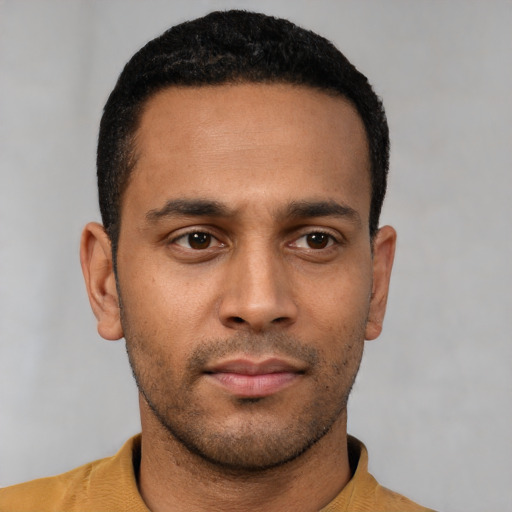 Neutral latino young-adult male with short  black hair and brown eyes