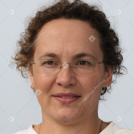 Joyful white adult female with short  brown hair and brown eyes