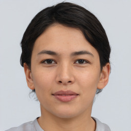 Joyful asian young-adult female with short  black hair and brown eyes