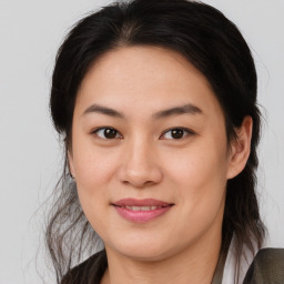 Joyful white young-adult female with medium  brown hair and brown eyes