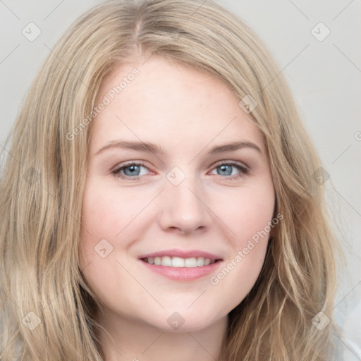 Joyful white young-adult female with long  brown hair and blue eyes