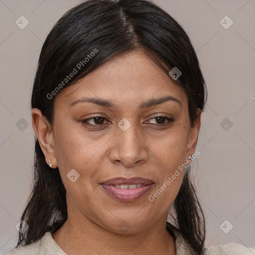 Joyful latino adult female with medium  brown hair and brown eyes