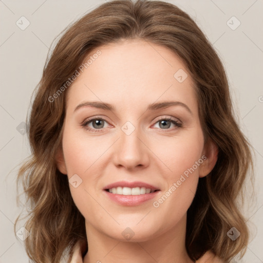 Joyful white young-adult female with long  brown hair and green eyes