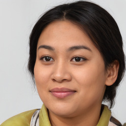 Joyful asian young-adult female with medium  brown hair and brown eyes