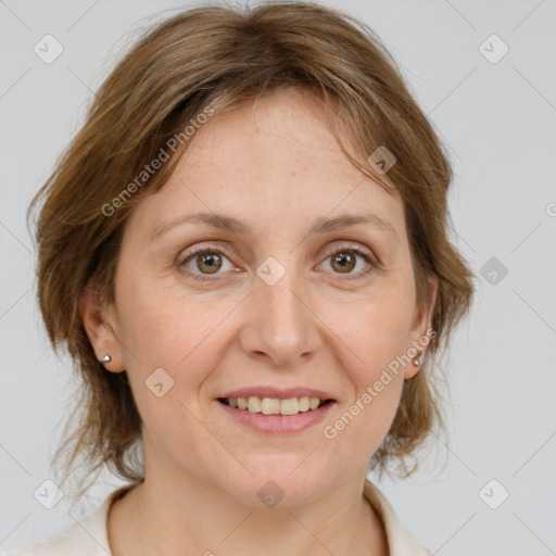 Joyful white adult female with medium  brown hair and grey eyes