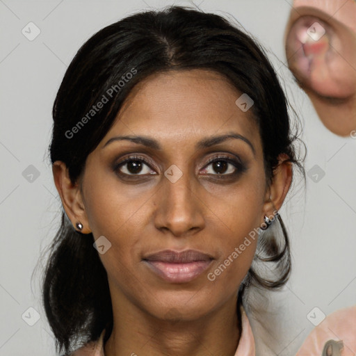 Joyful black young-adult female with medium  brown hair and brown eyes