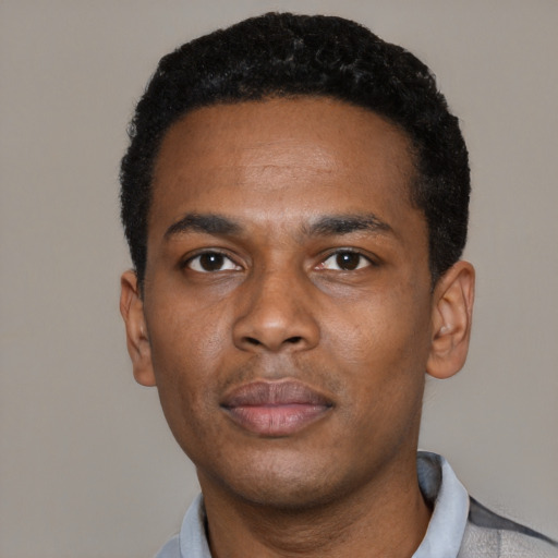 Neutral black young-adult male with short  black hair and brown eyes