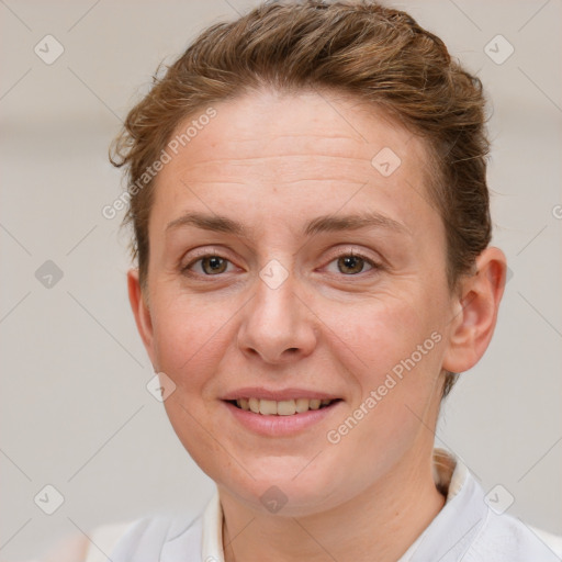 Joyful white adult female with short  brown hair and brown eyes