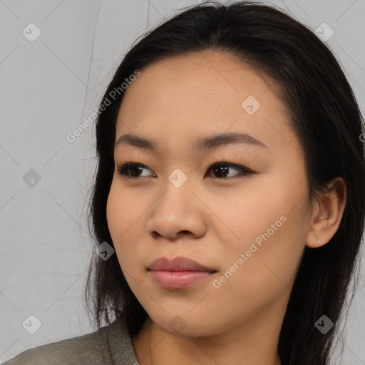 Joyful asian young-adult female with long  brown hair and brown eyes