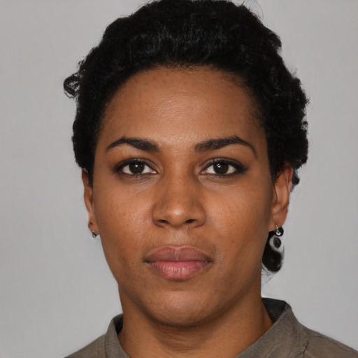 Neutral black young-adult female with short  black hair and brown eyes