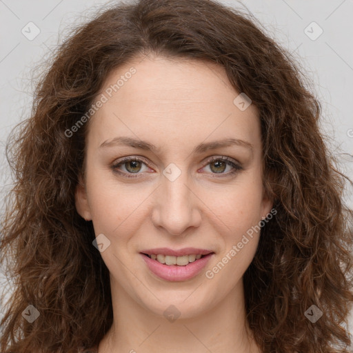 Joyful white young-adult female with long  brown hair and green eyes