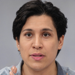 Joyful asian adult female with short  black hair and brown eyes