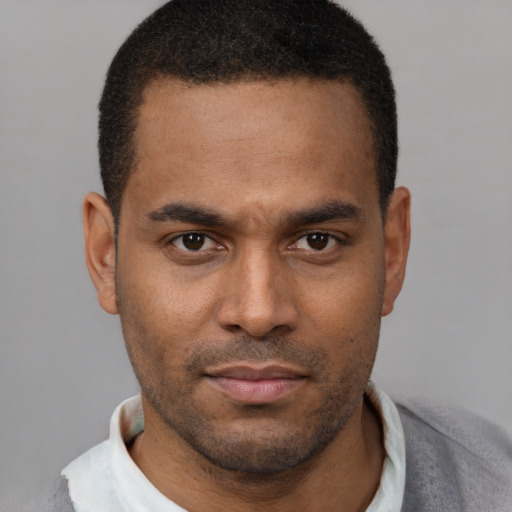 Neutral latino young-adult male with short  brown hair and brown eyes