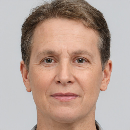 Joyful white middle-aged male with short  brown hair and brown eyes