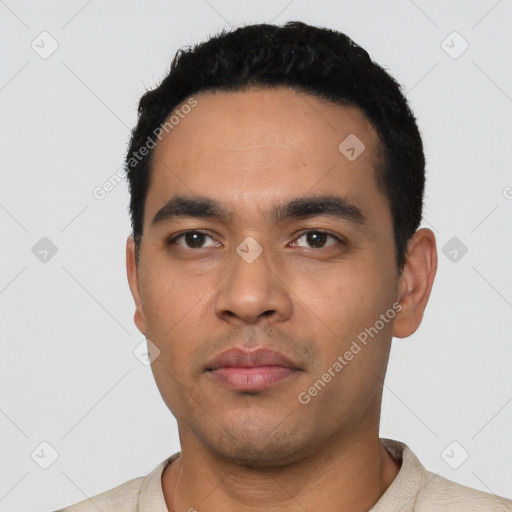 Neutral latino young-adult male with short  black hair and brown eyes