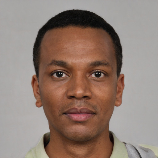 Neutral black young-adult male with short  black hair and brown eyes