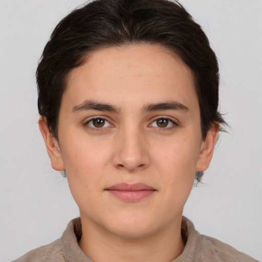 Neutral white young-adult female with short  brown hair and brown eyes