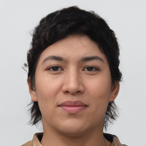 Joyful latino young-adult female with short  black hair and brown eyes