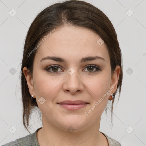 Joyful white young-adult female with medium  brown hair and grey eyes