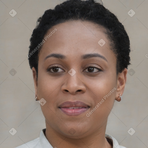 Joyful black young-adult female with short  black hair and brown eyes