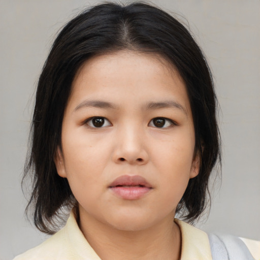 Neutral asian child female with medium  brown hair and brown eyes
