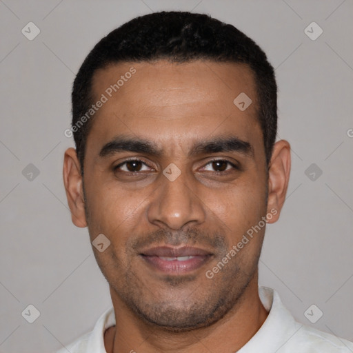 Joyful black young-adult male with short  black hair and brown eyes