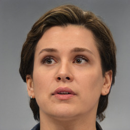 Neutral white young-adult female with medium  brown hair and brown eyes