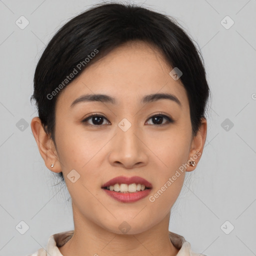 Joyful asian young-adult female with short  brown hair and brown eyes