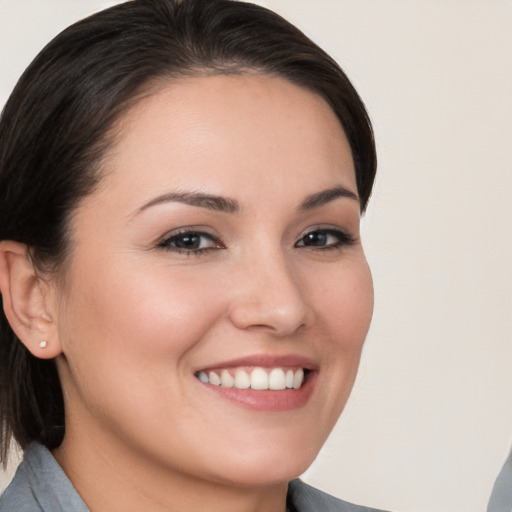 Joyful white young-adult female with medium  brown hair and brown eyes