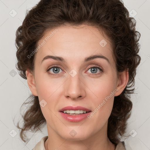 Joyful white young-adult female with medium  brown hair and green eyes