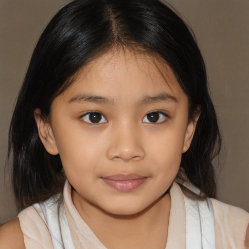 Joyful asian child female with medium  brown hair and brown eyes