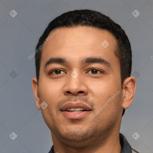 Joyful white young-adult male with short  black hair and brown eyes