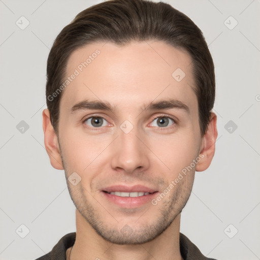 Joyful white young-adult male with short  brown hair and grey eyes