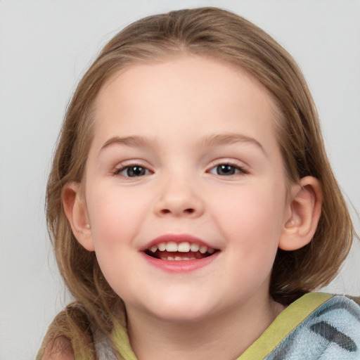 Joyful white child female with medium  brown hair and blue eyes