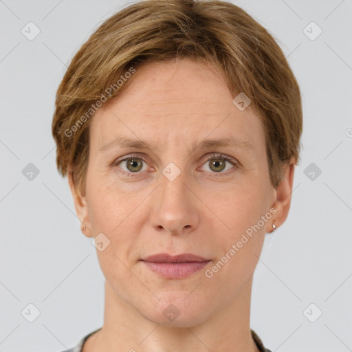 Joyful white adult female with short  brown hair and grey eyes