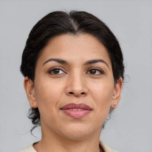 Joyful asian adult female with medium  brown hair and brown eyes