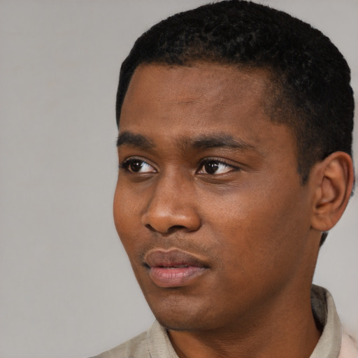 Neutral black young-adult male with short  black hair and brown eyes