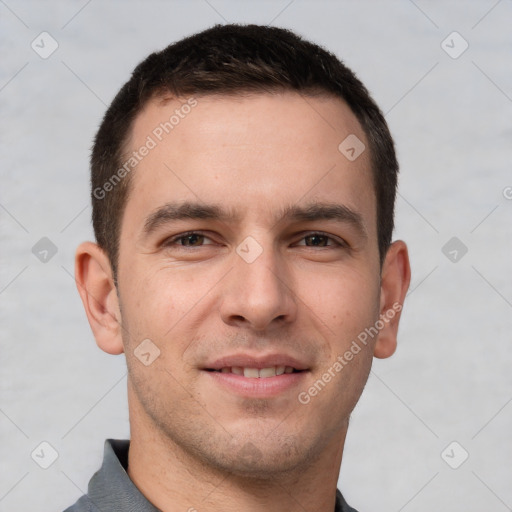 Joyful white young-adult male with short  brown hair and brown eyes