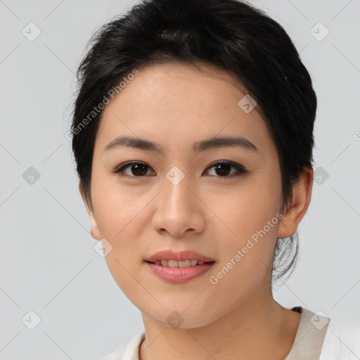 Joyful asian young-adult female with medium  black hair and brown eyes