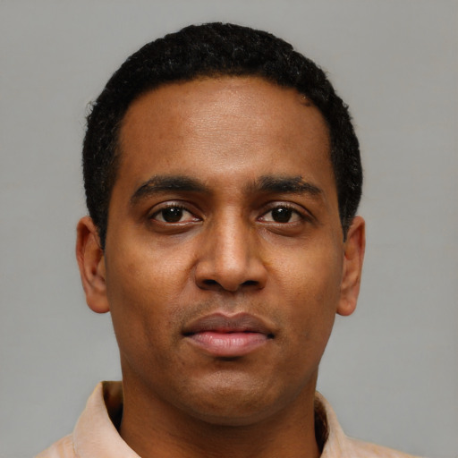 Neutral black young-adult male with short  black hair and brown eyes