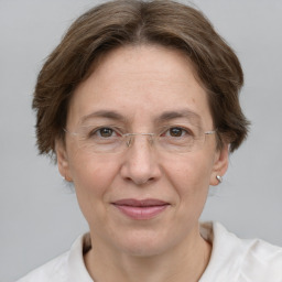 Joyful white adult female with short  brown hair and grey eyes